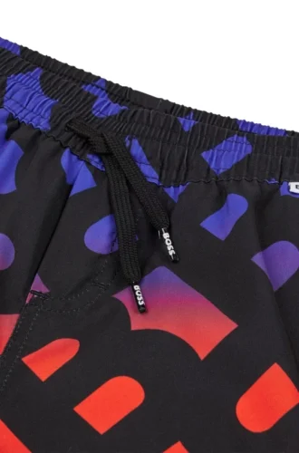 Badshorts för barn med monogramtryck i ton-i-ton