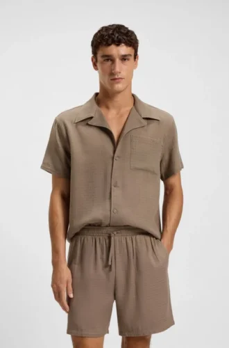 Badshorts i bomullsmuslin