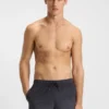 Badshorts med logotyp och monogramtryck i dégradé