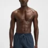 Badshorts med logotyp och monogramtryck i dégradé