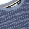 Barn-T-shirt i bomull med monogramtryck över hela plagget