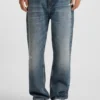 Blå baggy-jeans i slitna denim