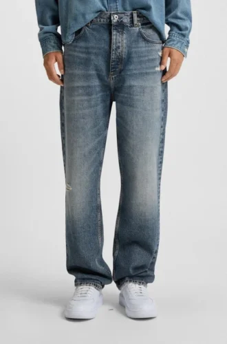 Blå baggy-jeans i slitna denim