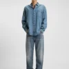 Blå baggy-jeans i slitna denim