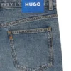 Blå baggy-jeans i slitna denim