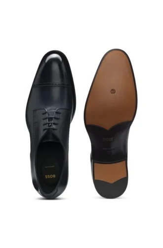 Derbyskor i läder med brogue-detaljer