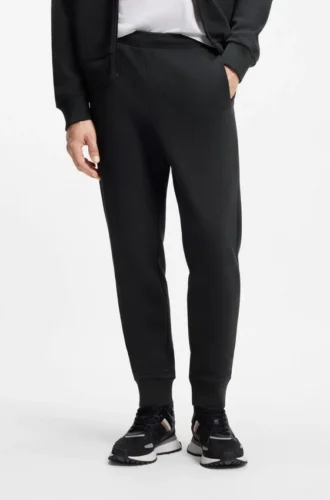 Joggingbyxor i bomullsblandning med broderat logo