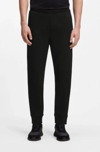 Joggingbyxor i bomullsblandning med broderat logo