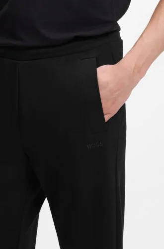 Joggingbyxor i bomullsblandning med broderat logo