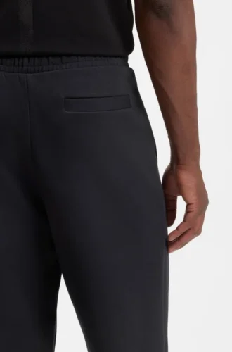 Joggingbyxor i stretchbomull med logotryck