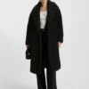 Kappa i fuskpäls med oversized-passform