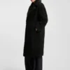 Kappa i fuskpäls med oversized-passform