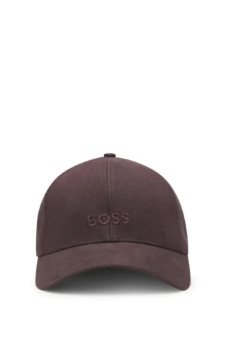 Kepsar i linne med broderad logotyp