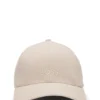 Kepsar i linne med broderad logotyp