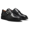 Läderskor med monk-rem och brogue-detaljer