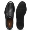 Läderskor med monk-rem och brogue-detaljer