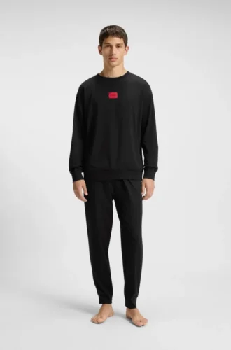 Pyjamas med rött logo i stretchbomull