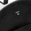 Ryggsäck i konstläder med reflekterande detaljer