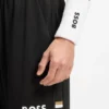Shorts i stretchjersey med logotyp och dold dragsko