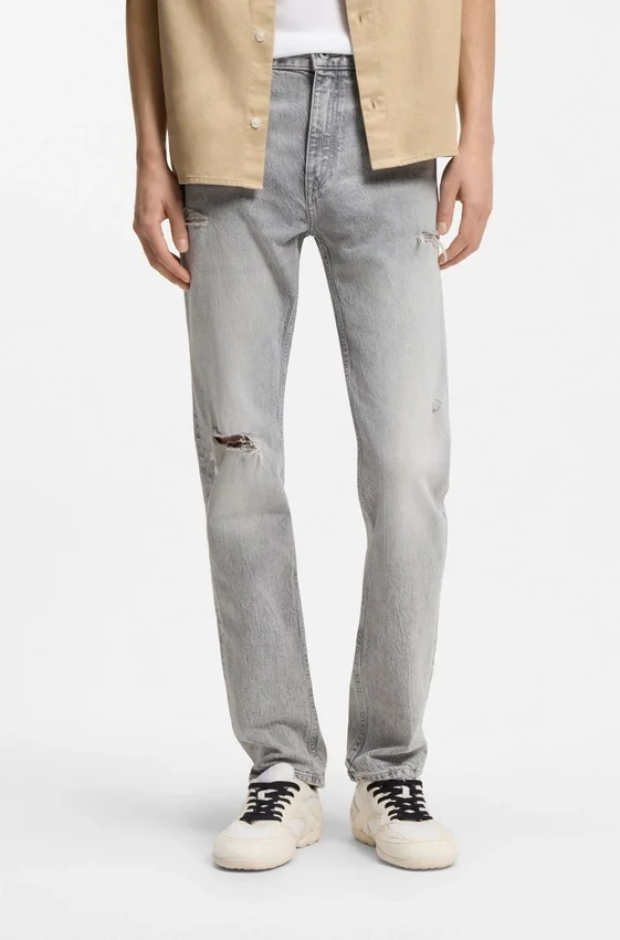 Slim fit-jeans i grå denim med slitna detaljer Slim fit-jeans i grå denim med slitna detaljer