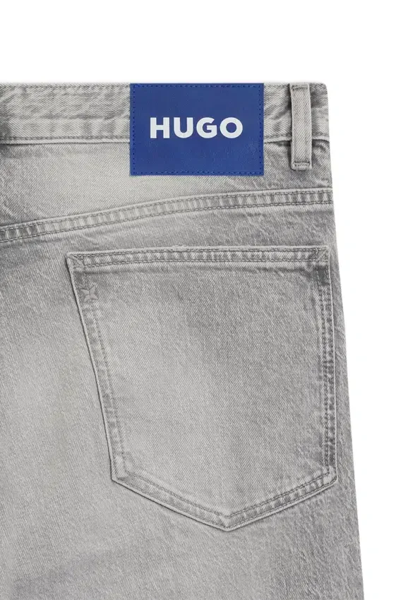 Slim fit-jeans i grå denim med slitna detaljer Slim fit-jeans i grå denim med slitna detaljer