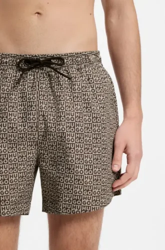 Snabbtorkande badshorts med rutmönster och staplade logotyper