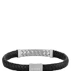 Svart flätad läderarmband med fiskbensmönstrade detaljer Svart flätad läderarmband med fiskbensmönstrade detaljer