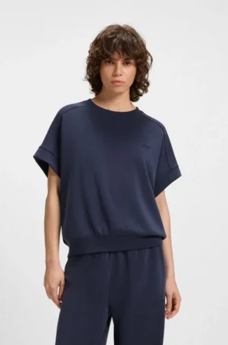 T-shirt med handskriven logotyp i oversized-passform