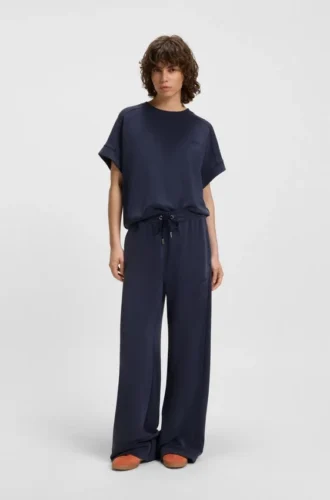 T-shirt med handskriven logotyp i oversized-passform