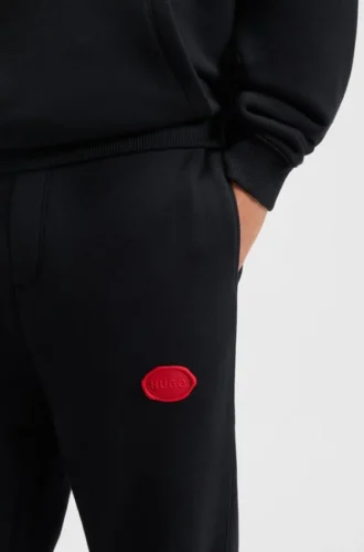 Träningsbyxor i bomullsblandning med vaxstämplat logo